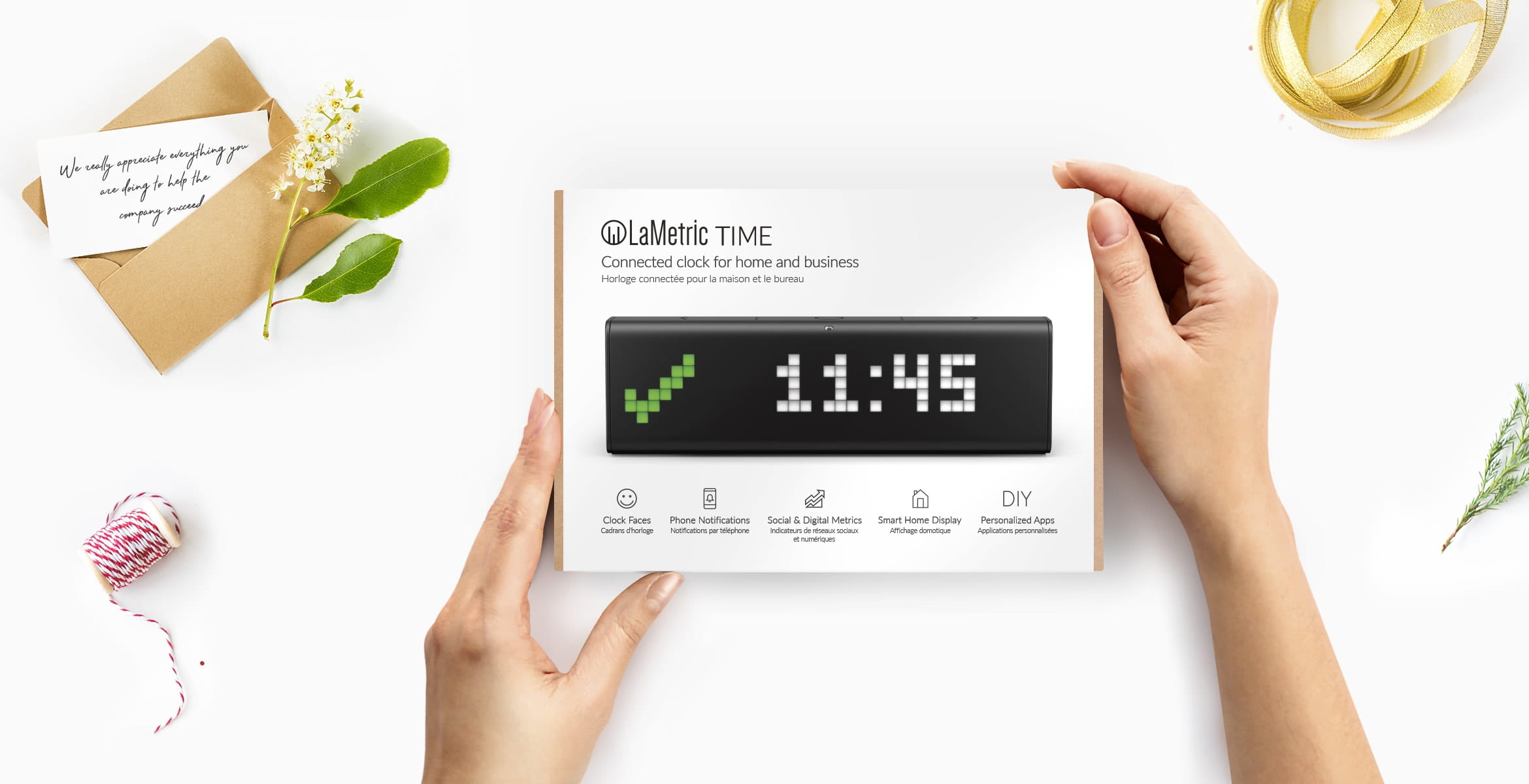LaMetric Time smart clock for home and business in its' giftbox depicted as a perfect gift for co-workers and employees