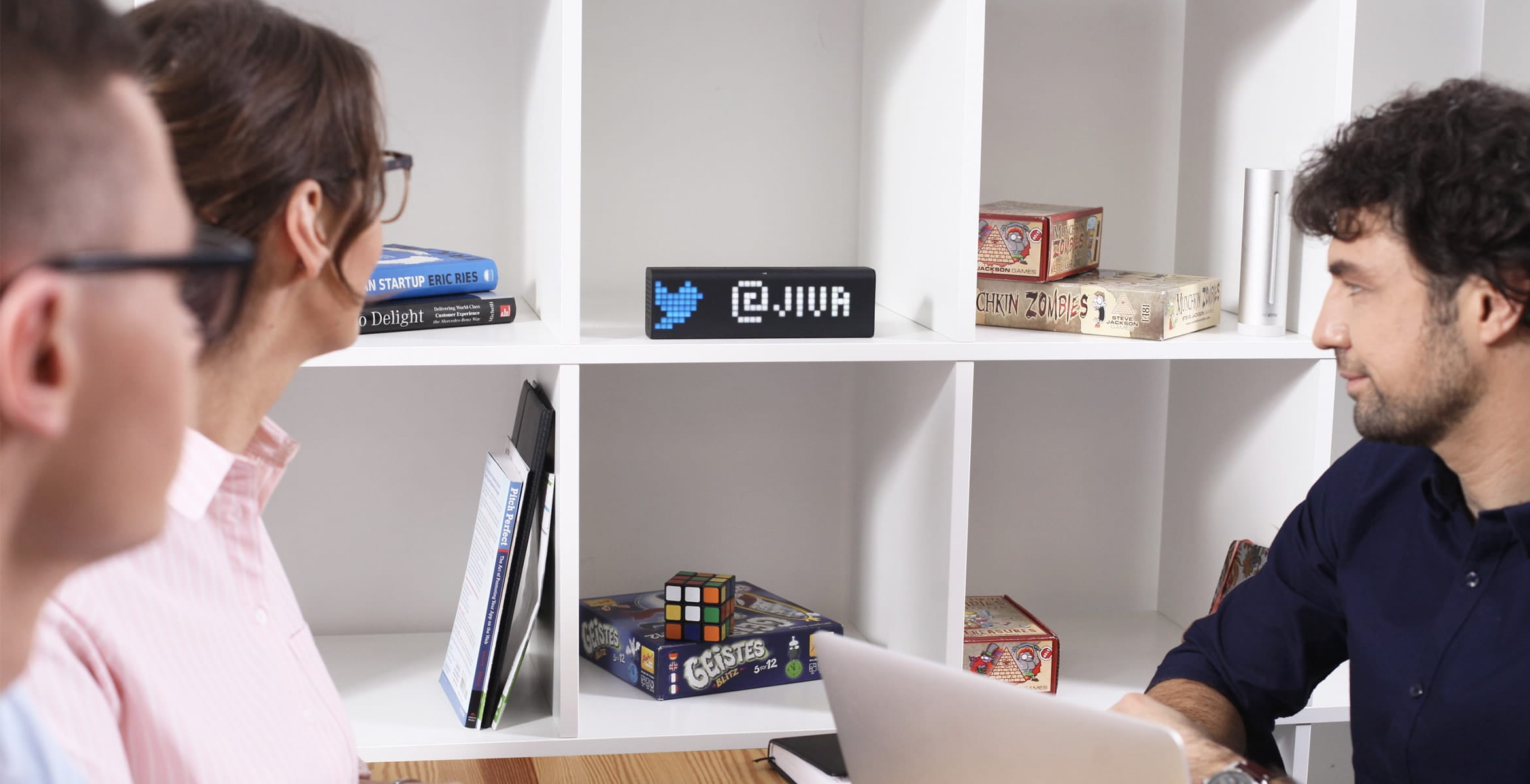 LaMetric Time smart clock, placed in a shelf, displaying people brand mention in Twitter