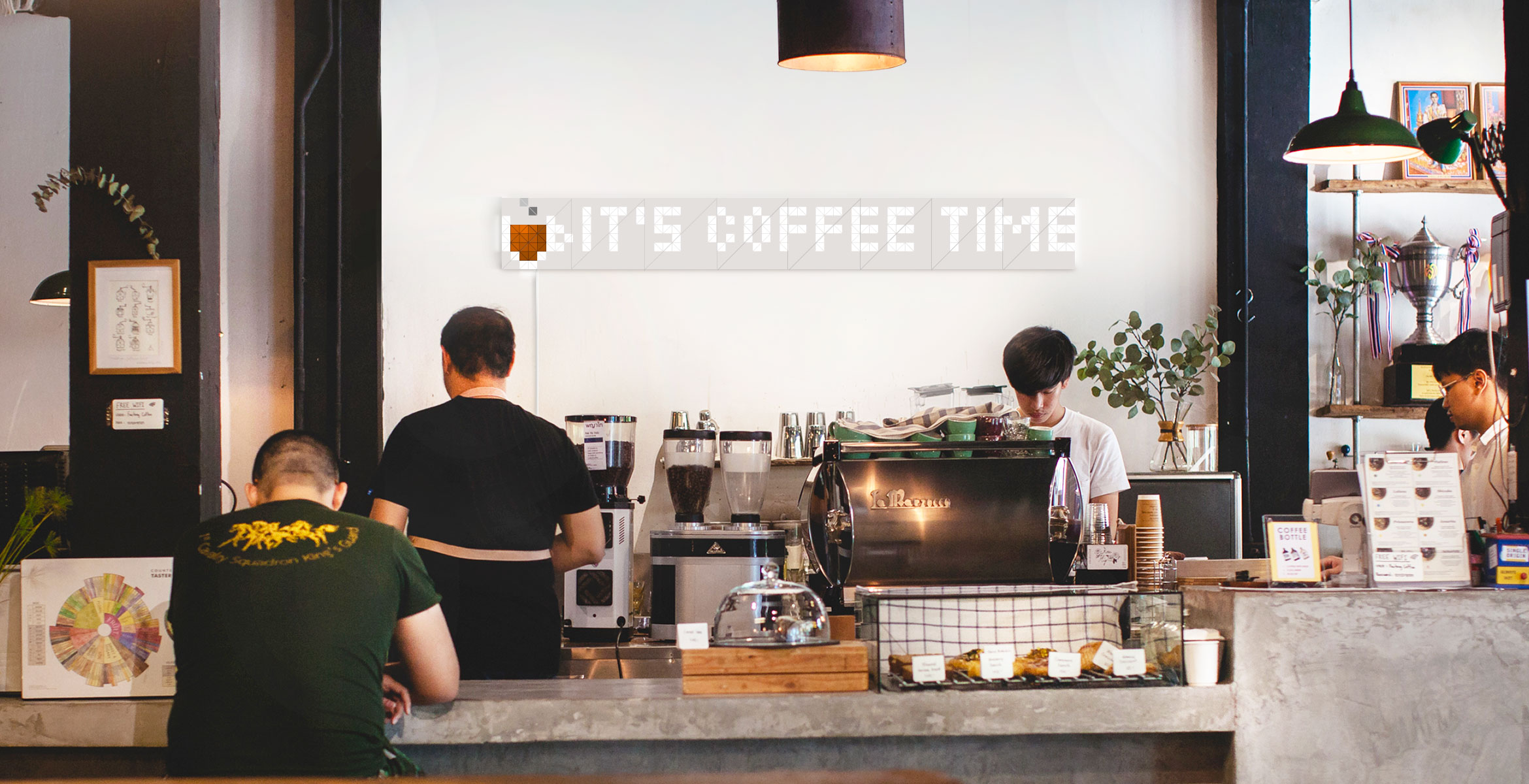 Infoscreen, assembled from 16 smart light surfaces, complements cafe interior and displays a message "It's coffee time"