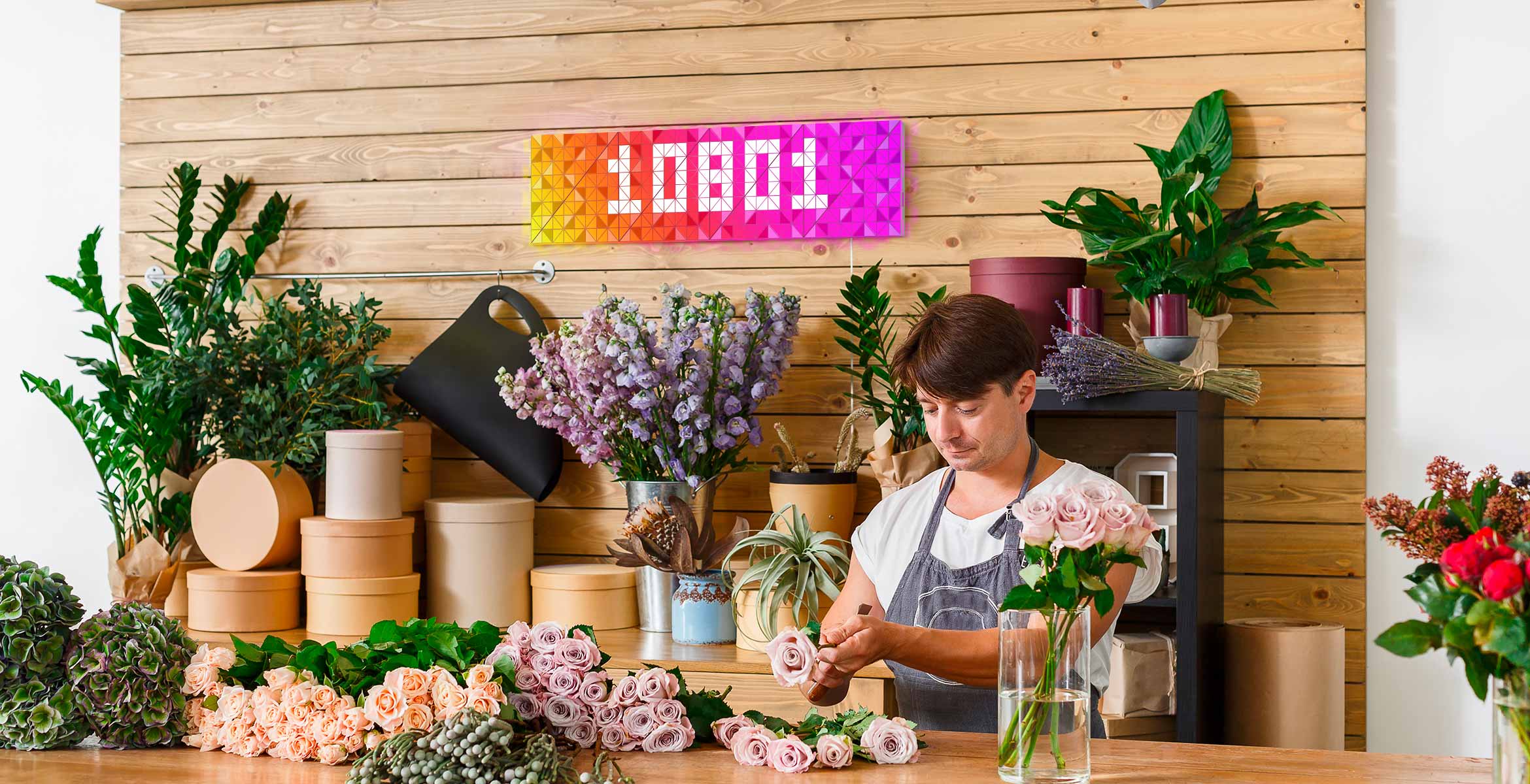 Infoscreen, assembled from 16 smart light surfaces, complements flower shop's interior and displays Instagram follower count