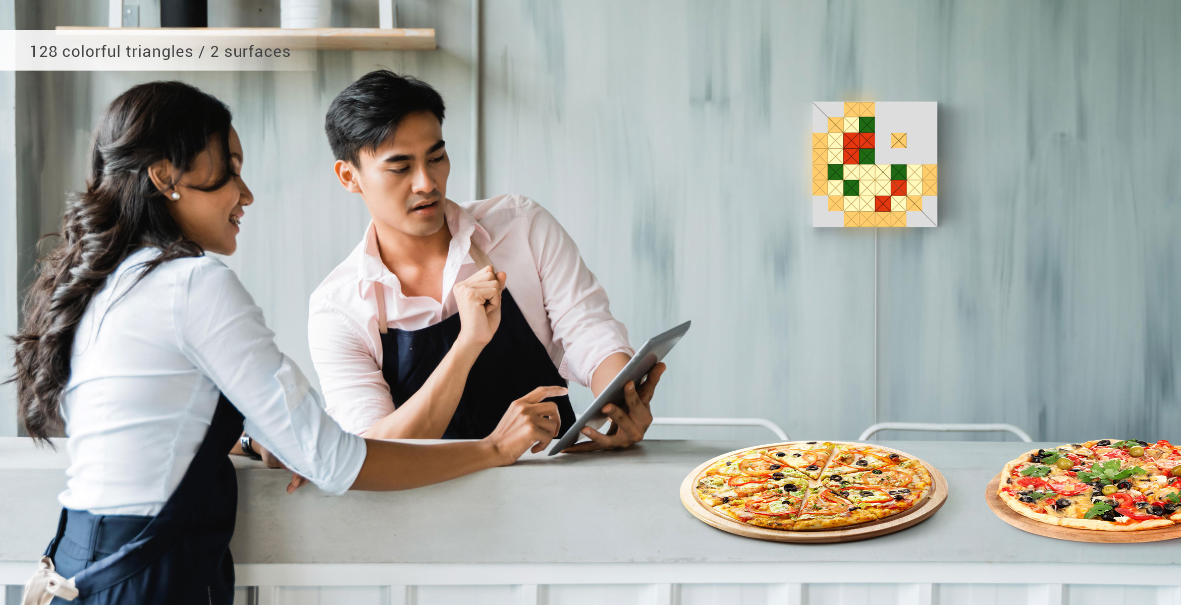 LaMetric SKY face shape, assembled from 4 smart light surfaces, displays a pizza SKY face and complements pizzeria's interior
