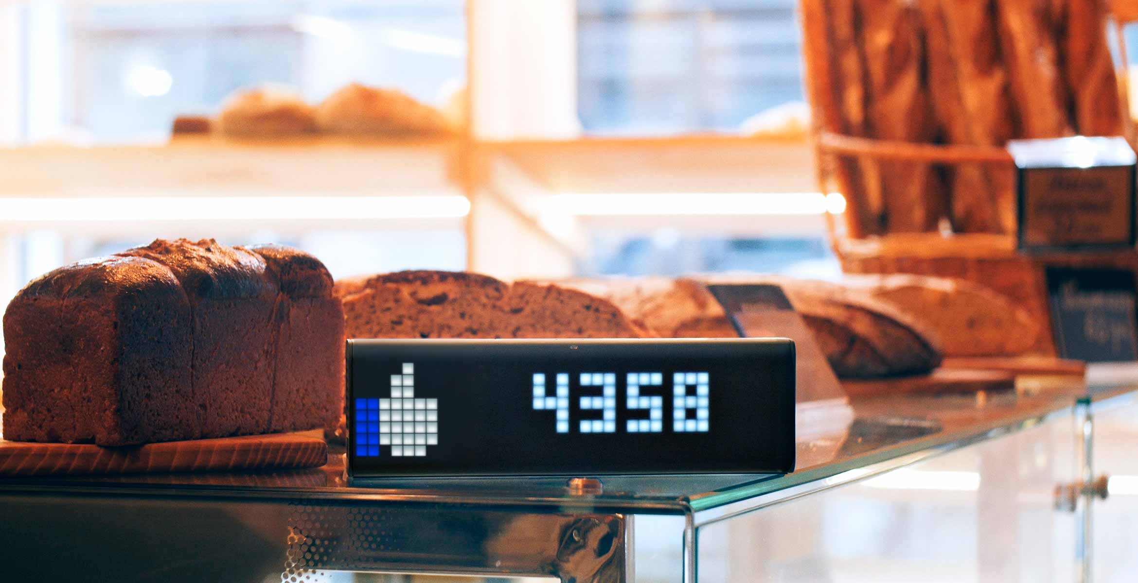 LaMetric Time smart clock, placed on the backery's shop front, displays Facebook like counter