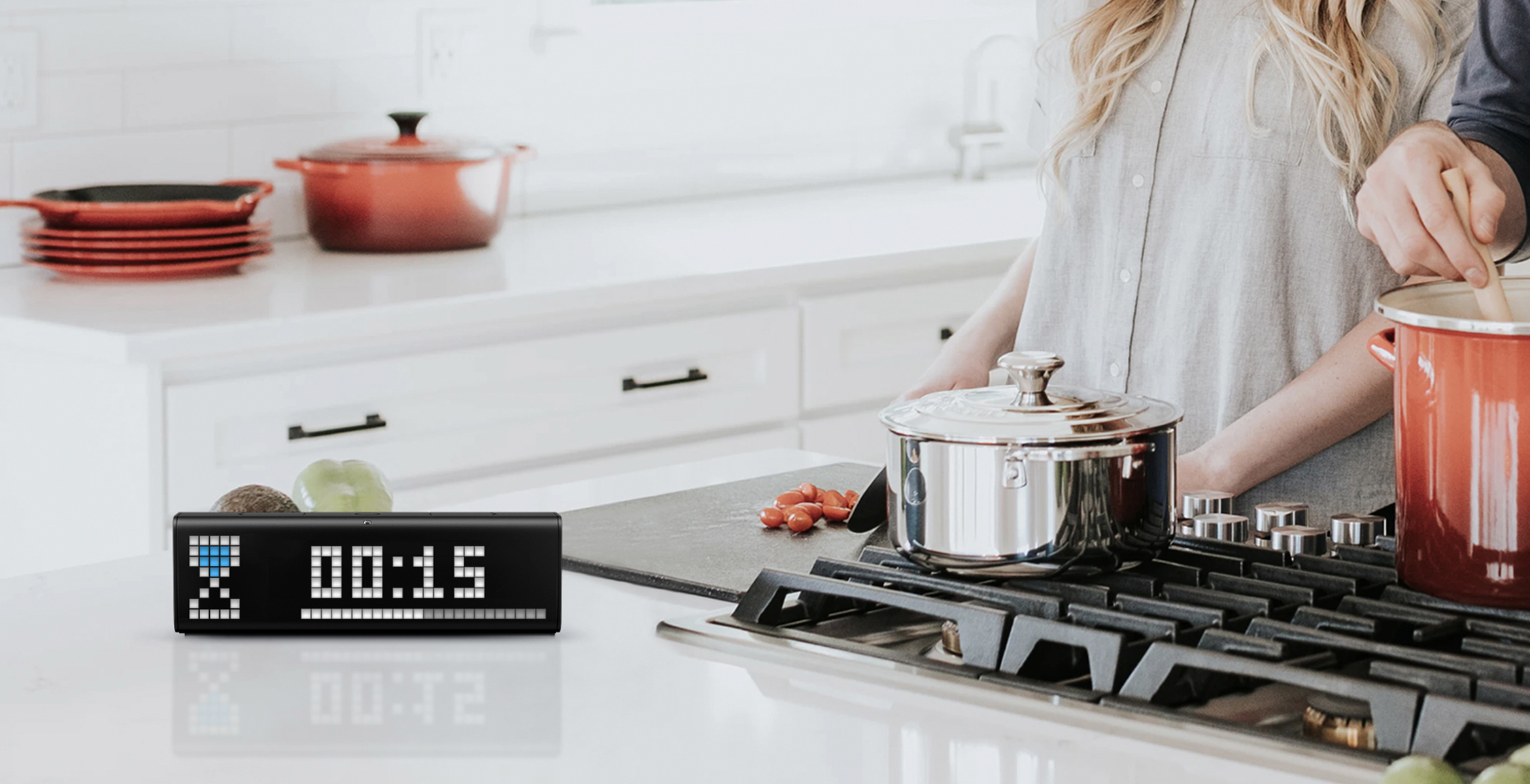 LaMetric Time digital clock stands on the kitchen table and shows the time countdown