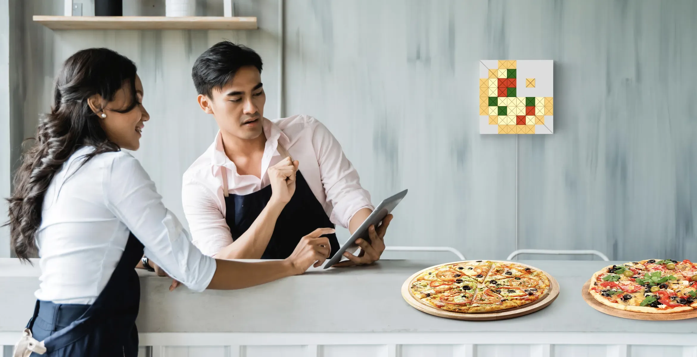 LaMetric SKY face shape, assembled from 2 smart light surfaces, displays a pizza SKY face and complements pizzeria's interior